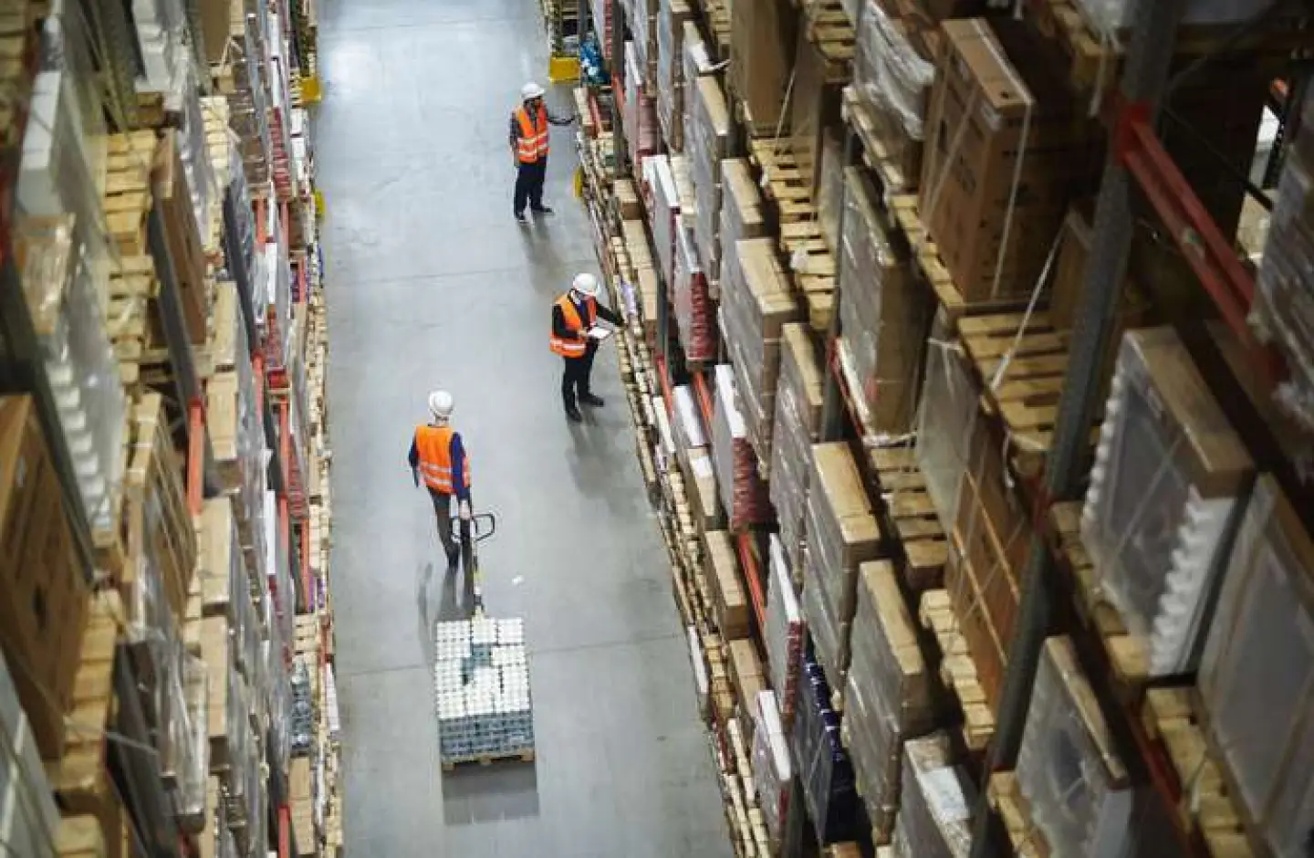 Warehouse workers moving around an efficient layout design.