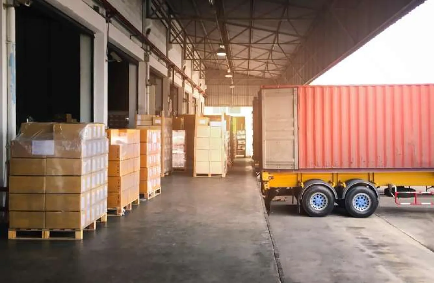 Benefits of a Warehouse Management System - A Cargo Truck in a Loading/Unloading Warehouse Area