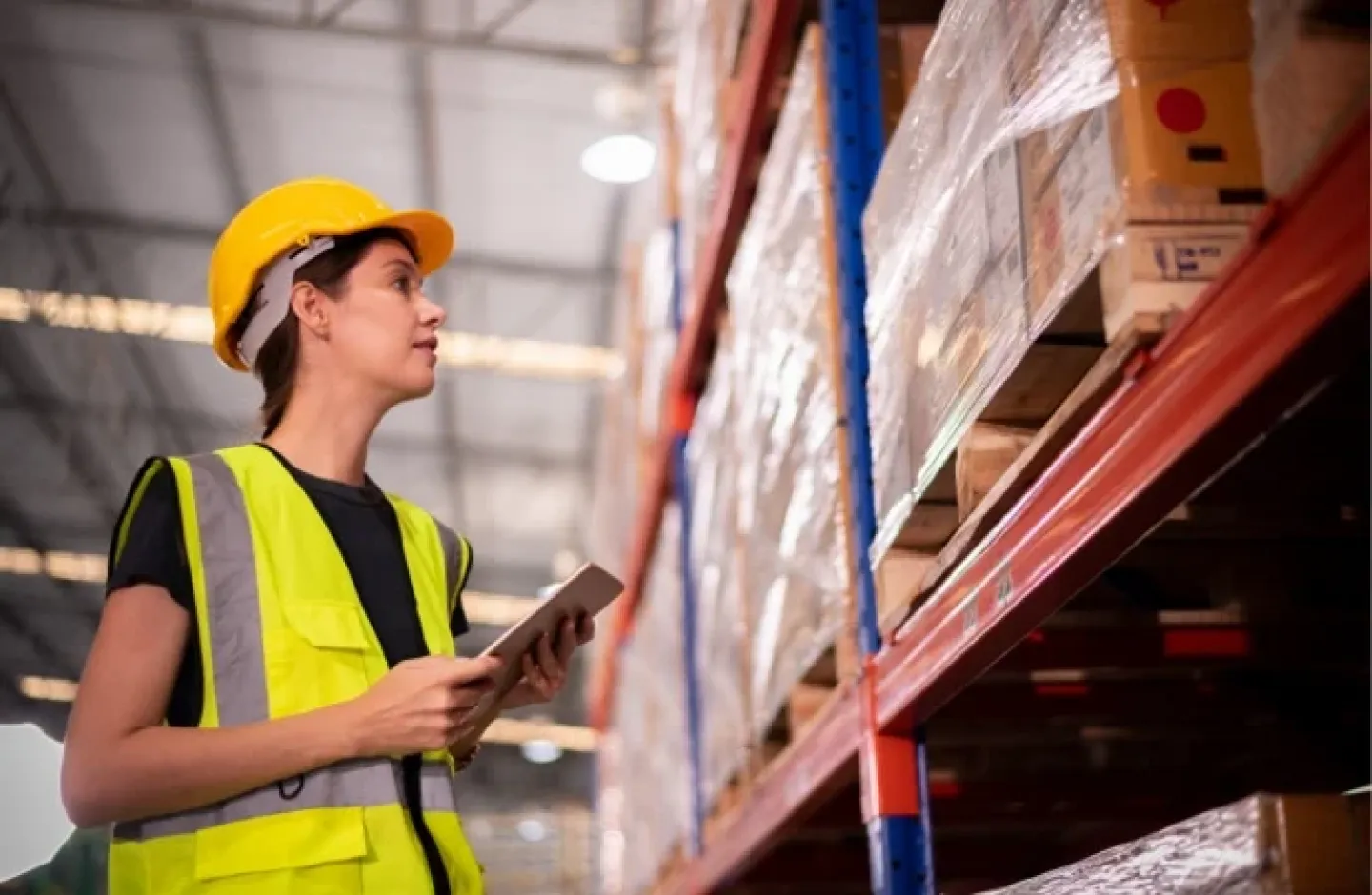 Warehouse employee streamlining inventory to reduce warehouse costs.