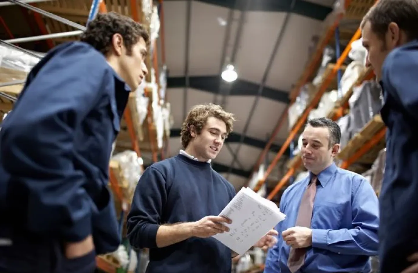 Warehouse workers collaborating.