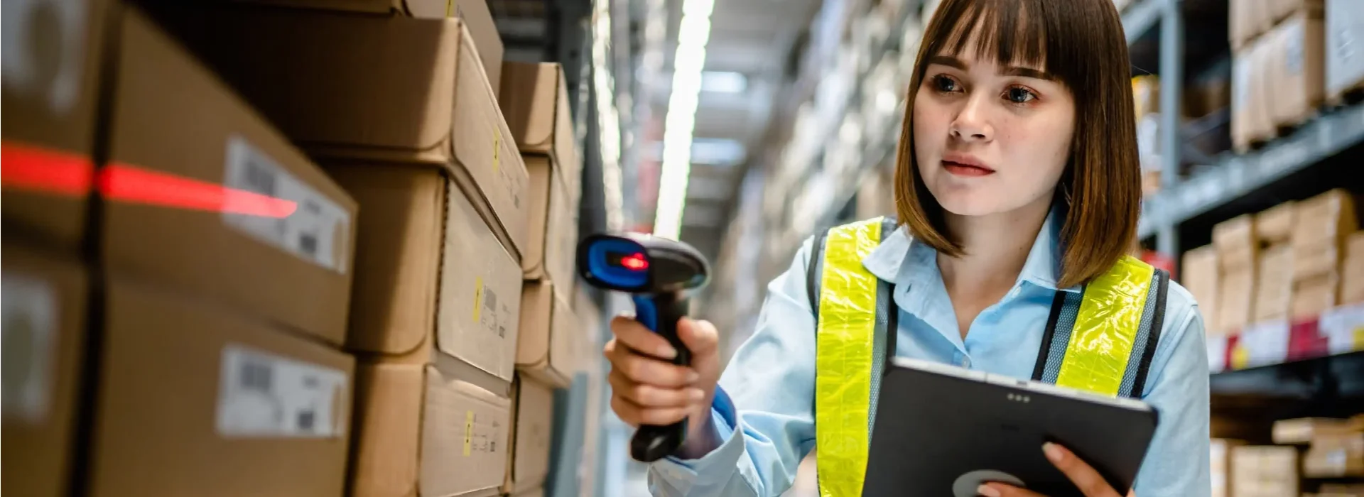 Warehouse employee using barcoding.