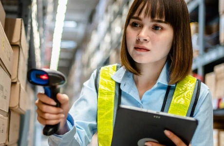 Warehouse employee using barcoding.